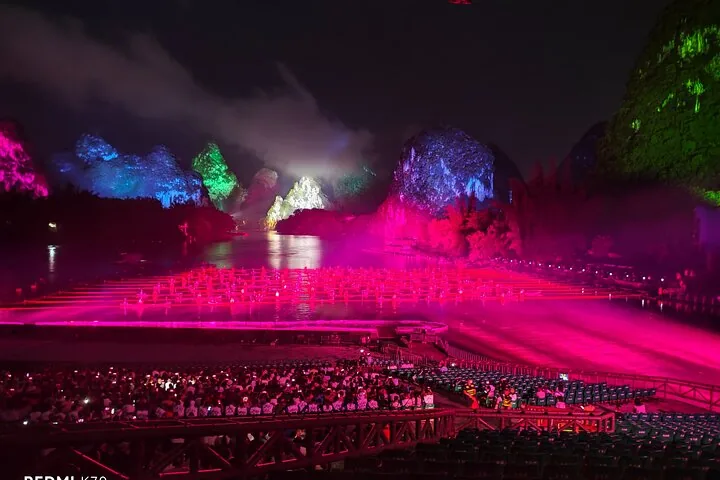 Impression Sanjie Liu night show with illuminated karst mountains and rafts
